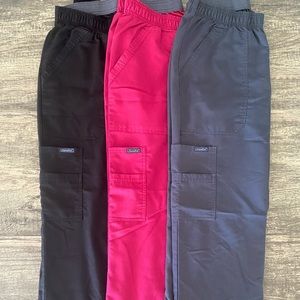 Gently used scrub pants in black, gray & pink